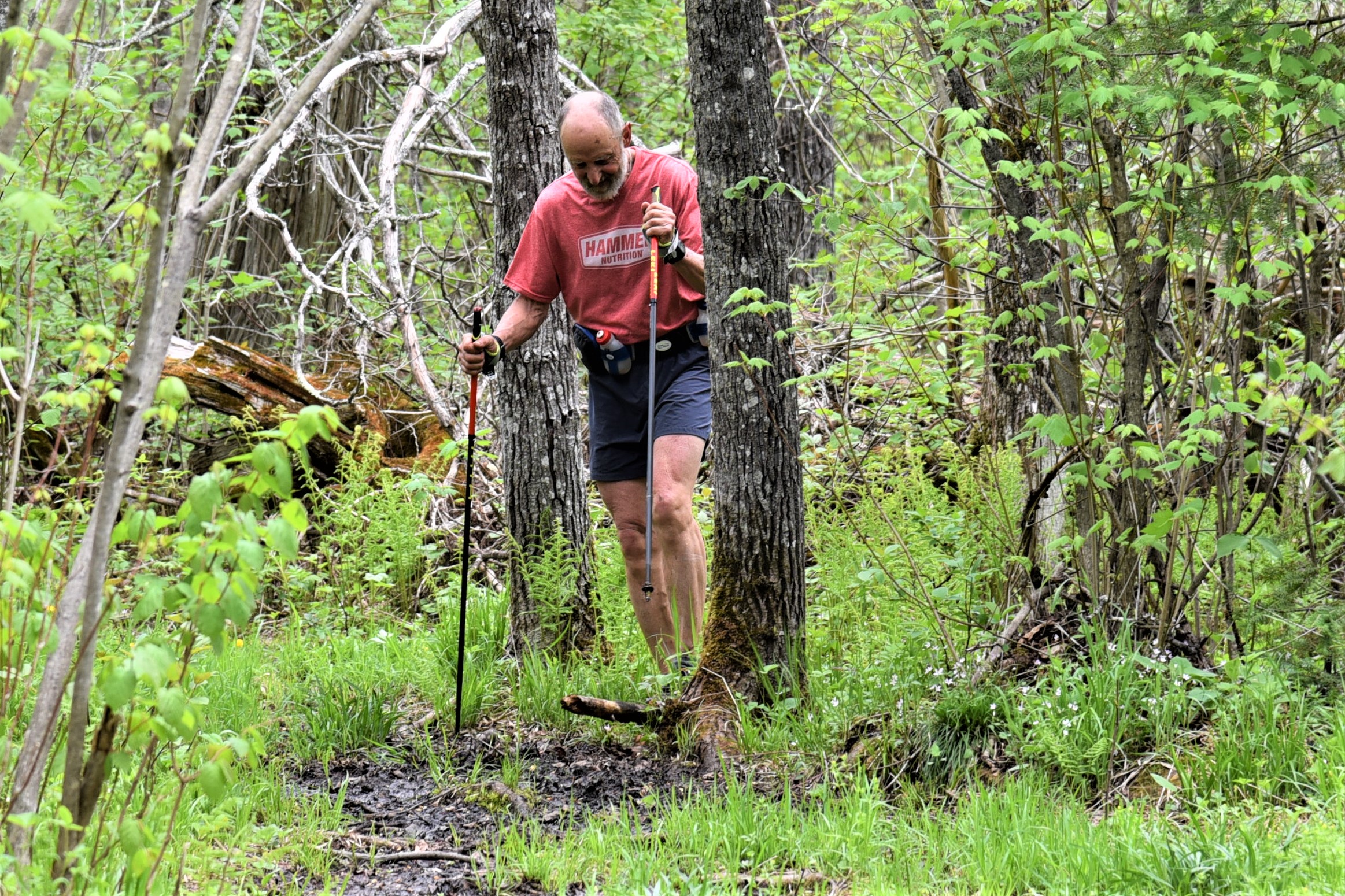 person running on hiking trail