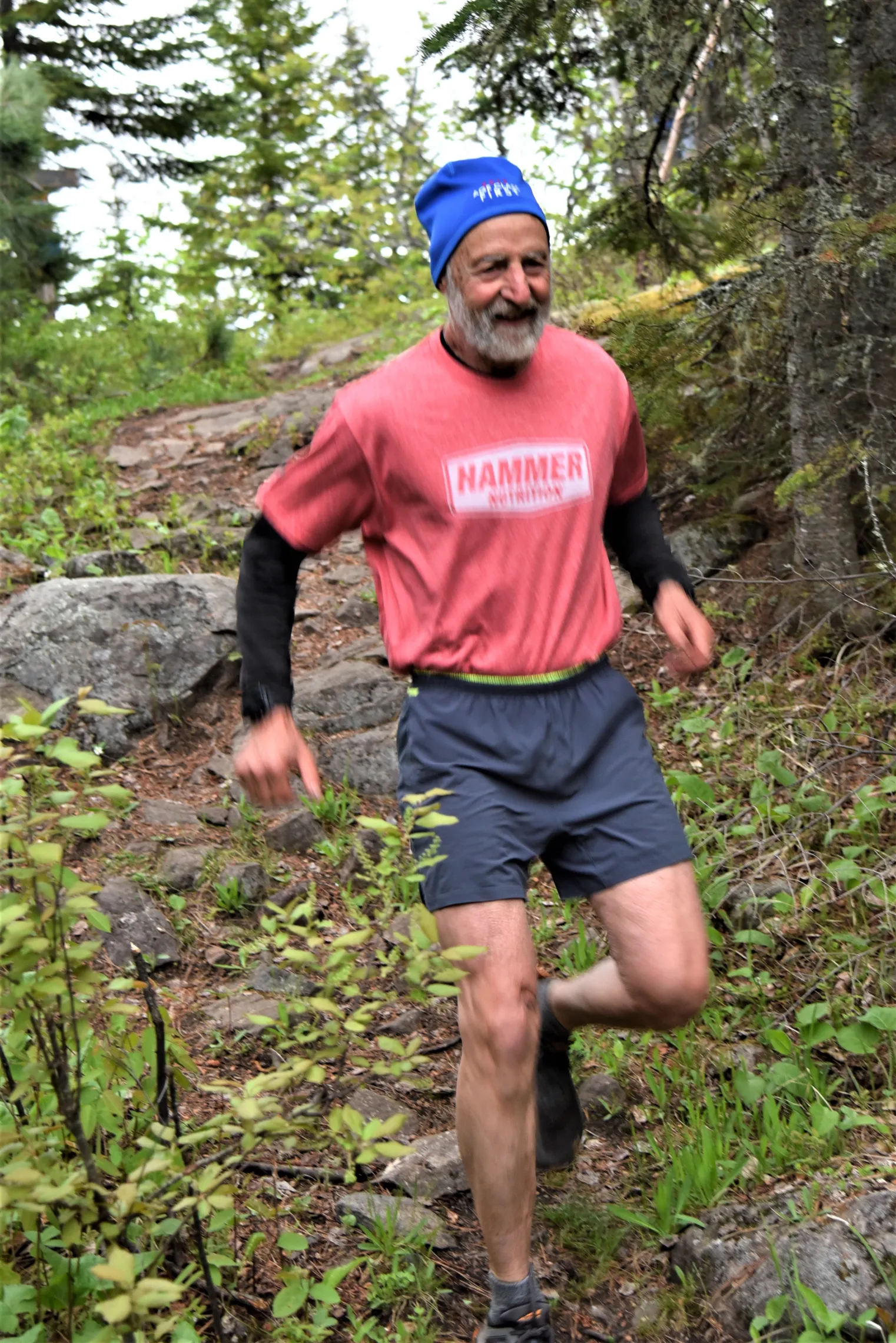 person running on hiking trail