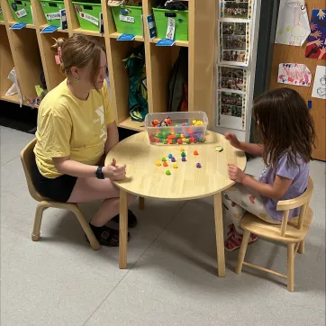 teacher helping child