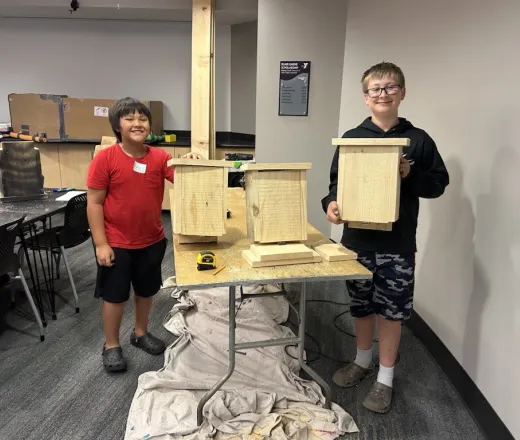 two youth making bat houses at the Duluth YMCA